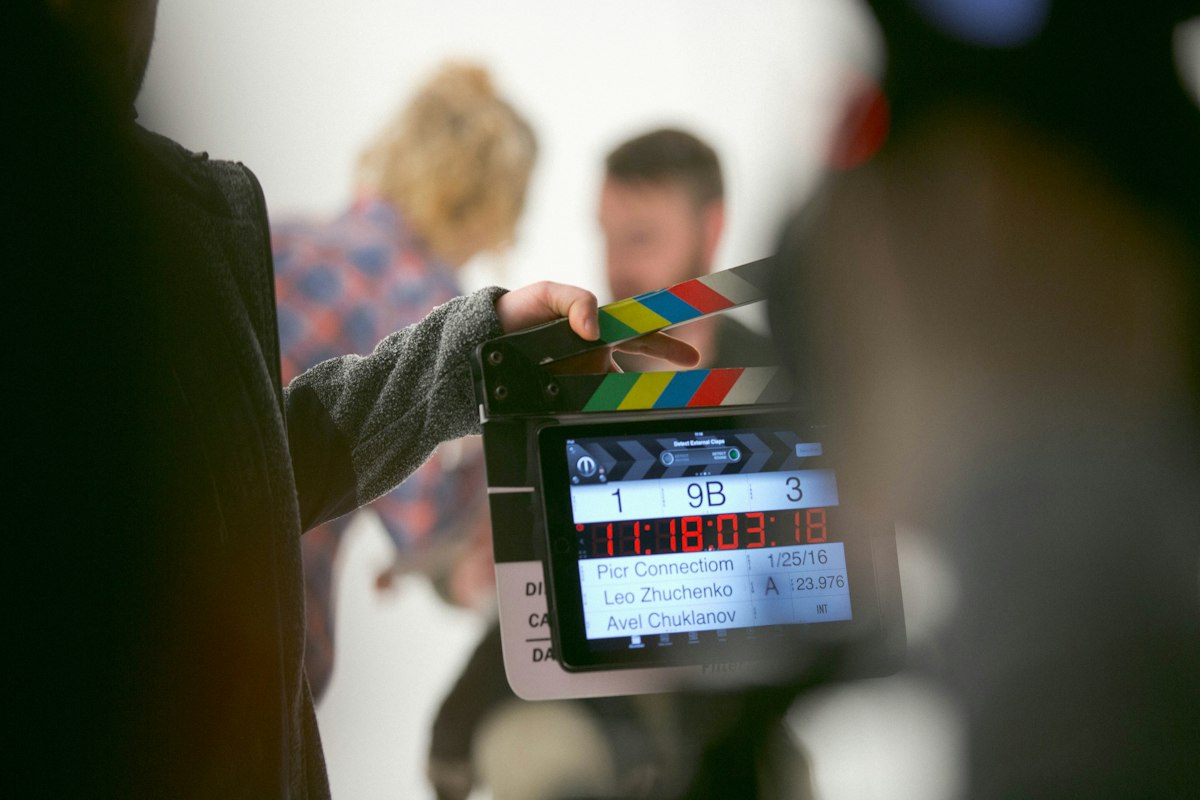 Person holding a clapperboard