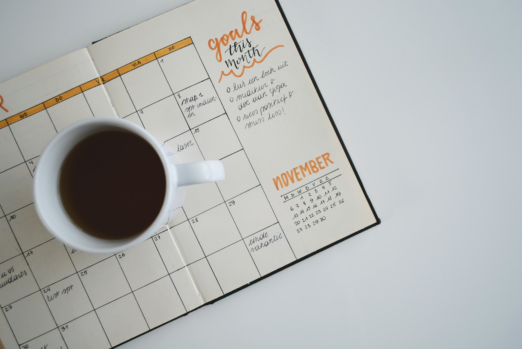 A planner calendar open on a desk